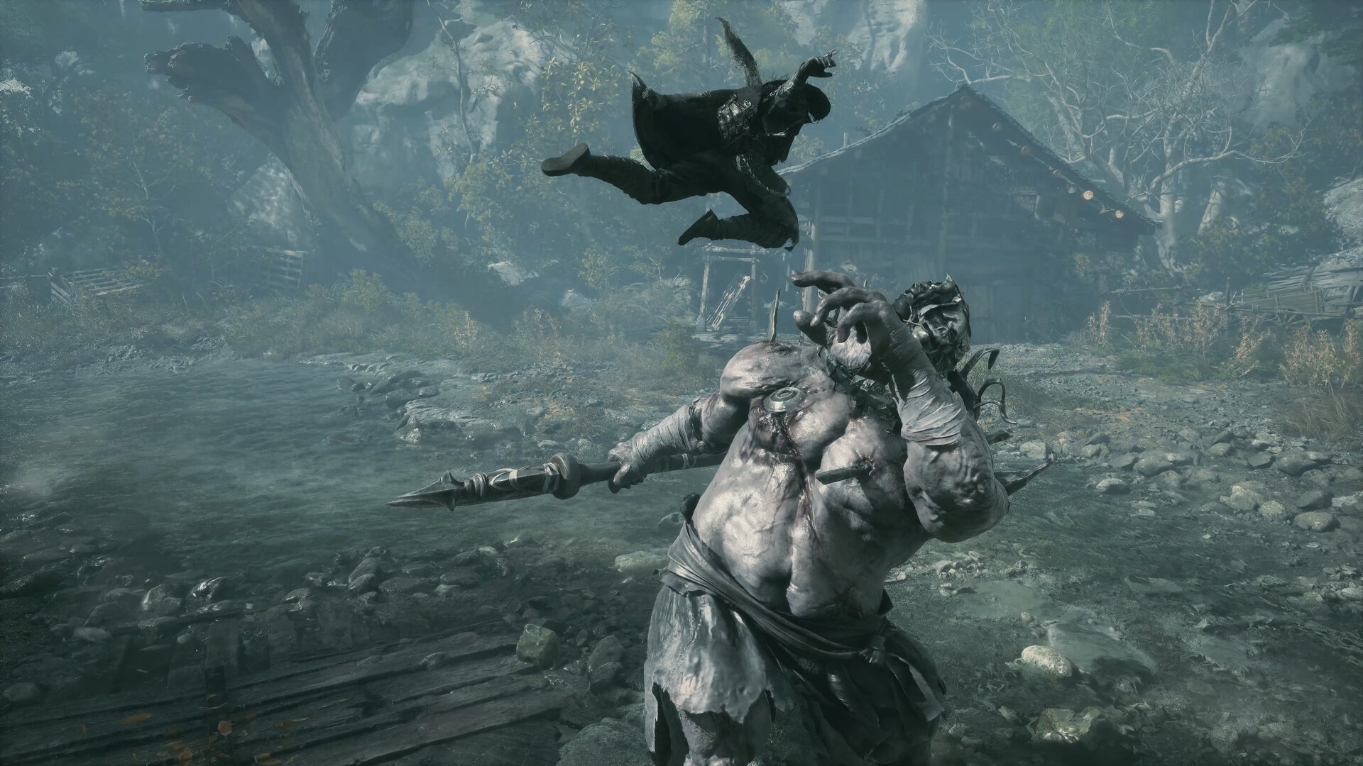 Soul leaps through the air above a towering enemy wielding a long polearm, with a weathered wooden cabin in the mist behind him